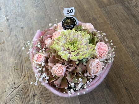 Bloemstukje rond lichtroze tinten